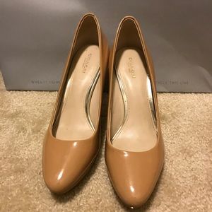 Coach patent leather pumps.